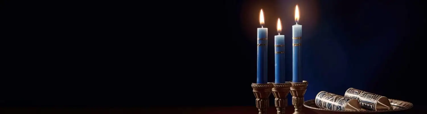 Three candles lighting in a dark background