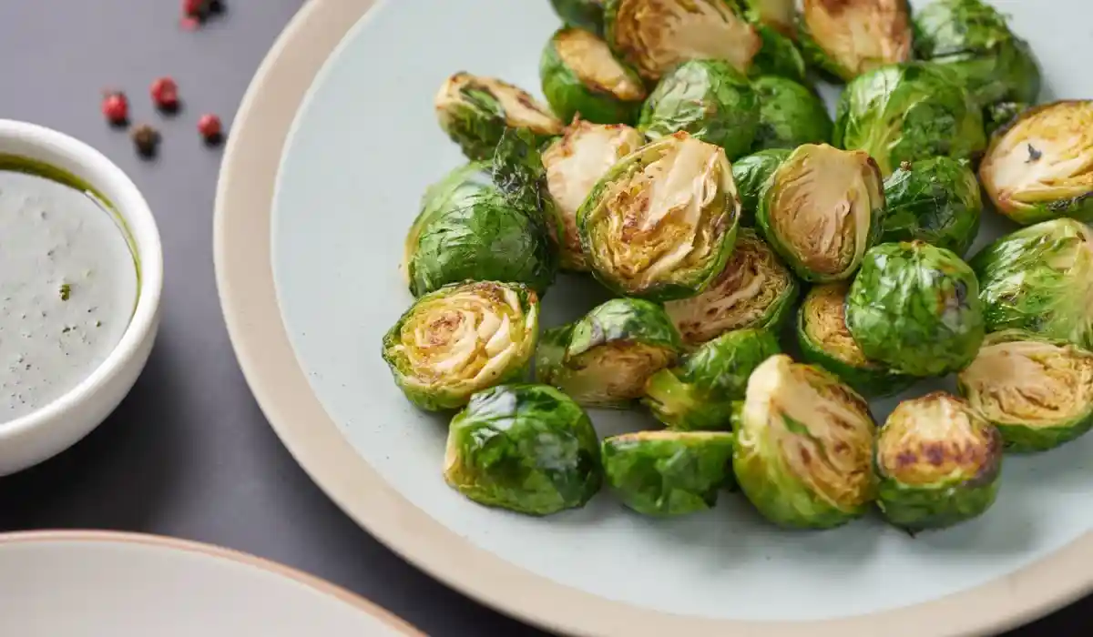 Vegetarian cuisine homemade roasted brussels sprouts with olive oil dish table