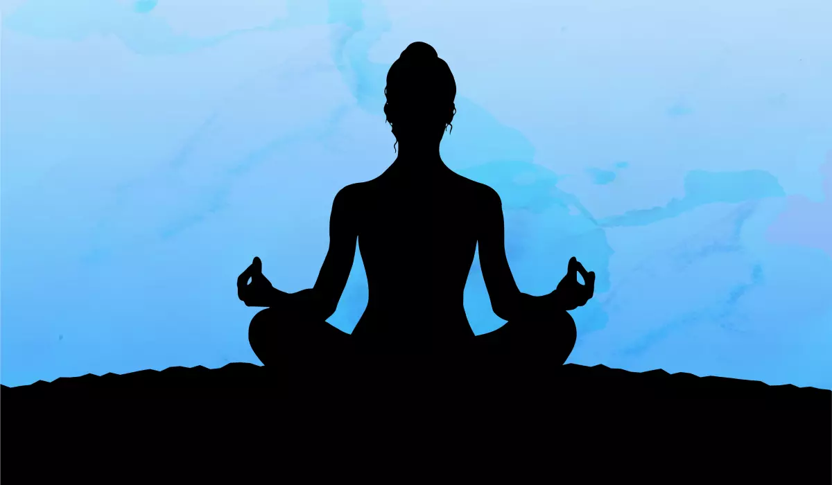 Silhouete of a woman practicing yoga