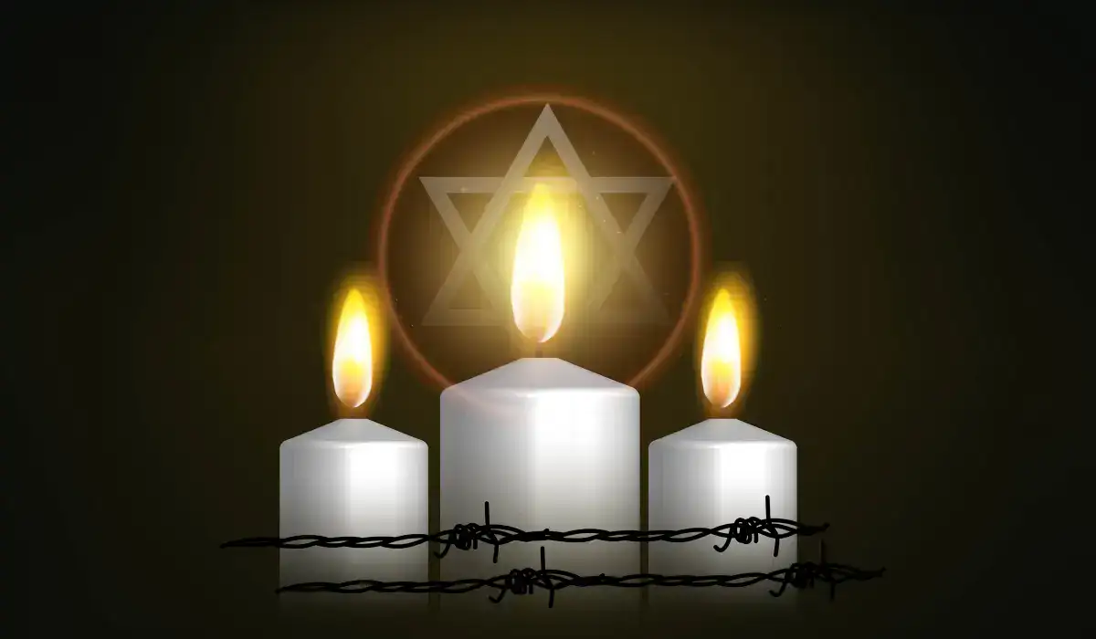 Three candles with star of David in the background as a remembrance of the holocaust