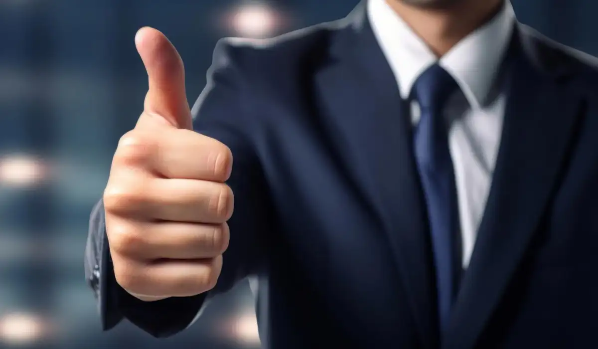 Man in suit giving thumb up