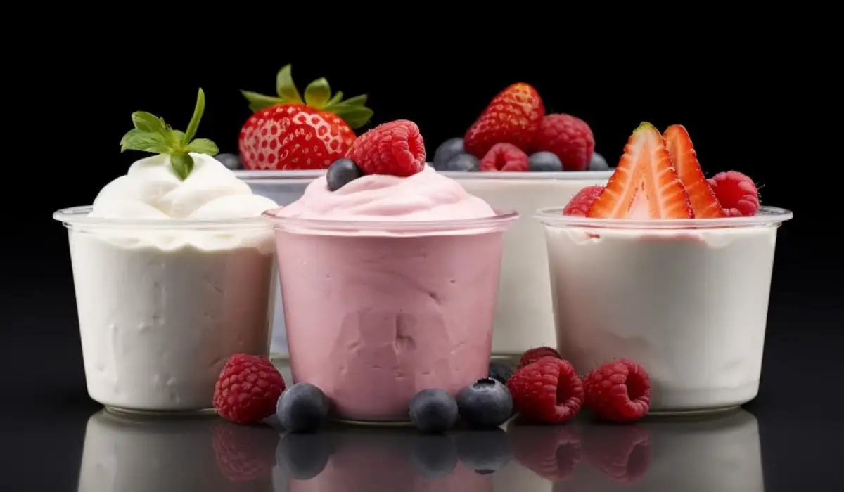Yogurt products with strawberries on a dark background
