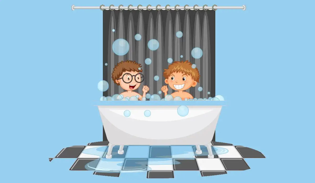 Two children smiling in the bathtub taking a bath together