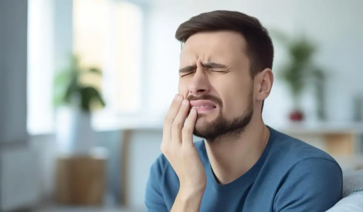 Upset man has unbearable toothache while at home