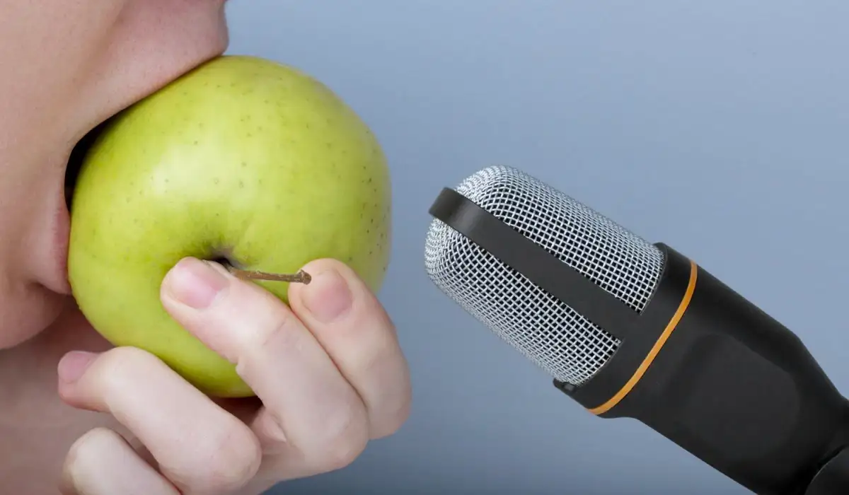 Person eating an apple near the microphone for asmr