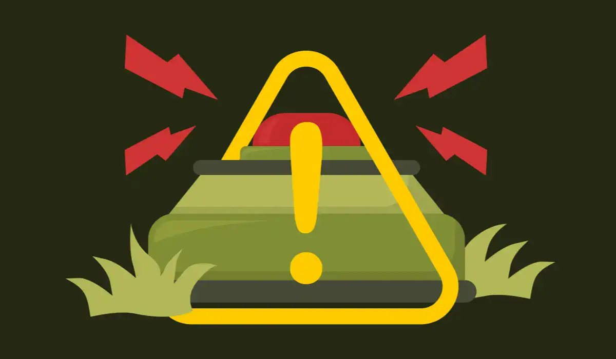 A landmine in the grass with danger sign linking it