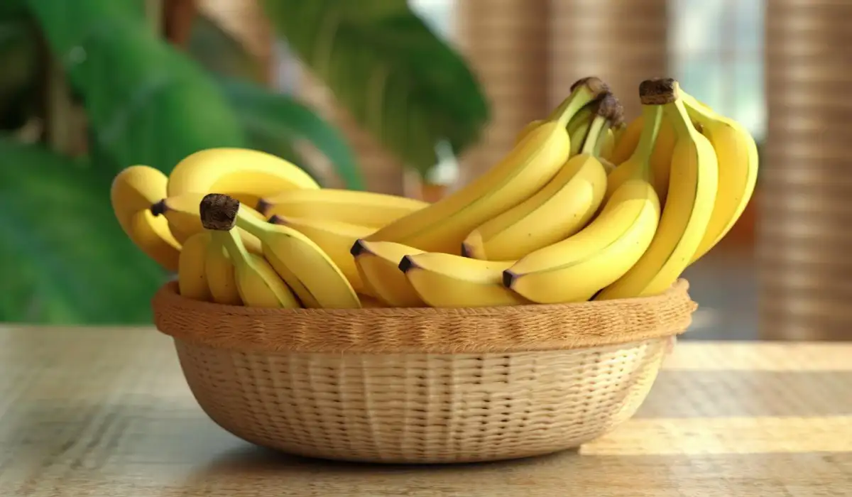 Many bananas in a basket on a table