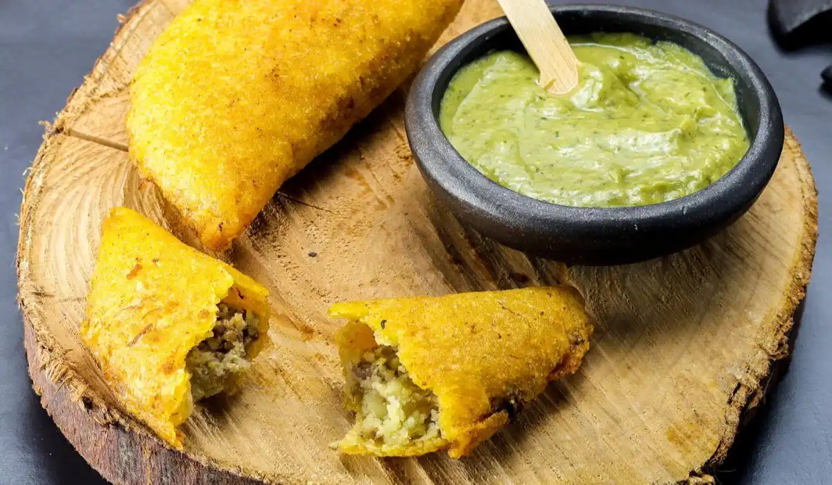 Corn empanada, typical Colombian food with spicy sauce