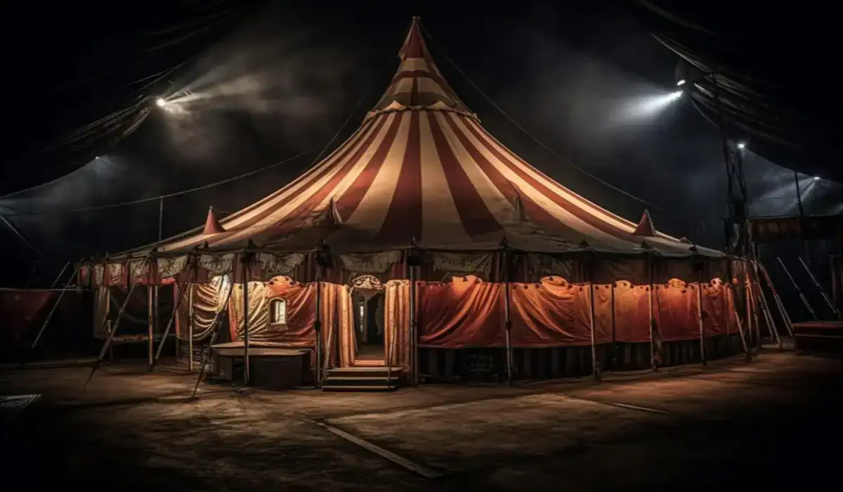 A colorful circus illuminated in the middle of the night before a performance