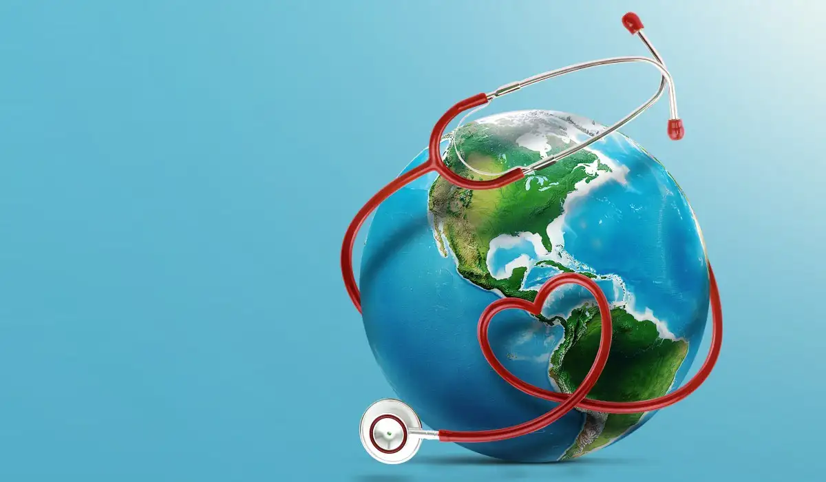 Realistic stethoscope in shape of red heart and world with blue background.