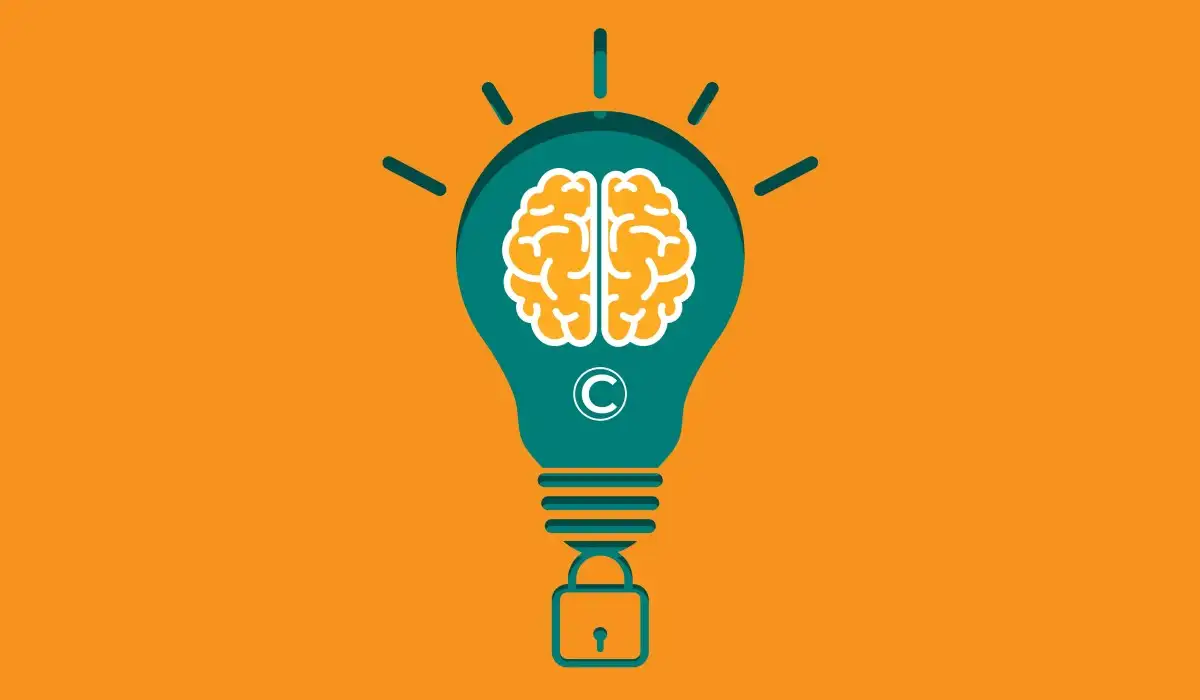 Light bulb with a brain inside in intellectual property symbol on an orange background