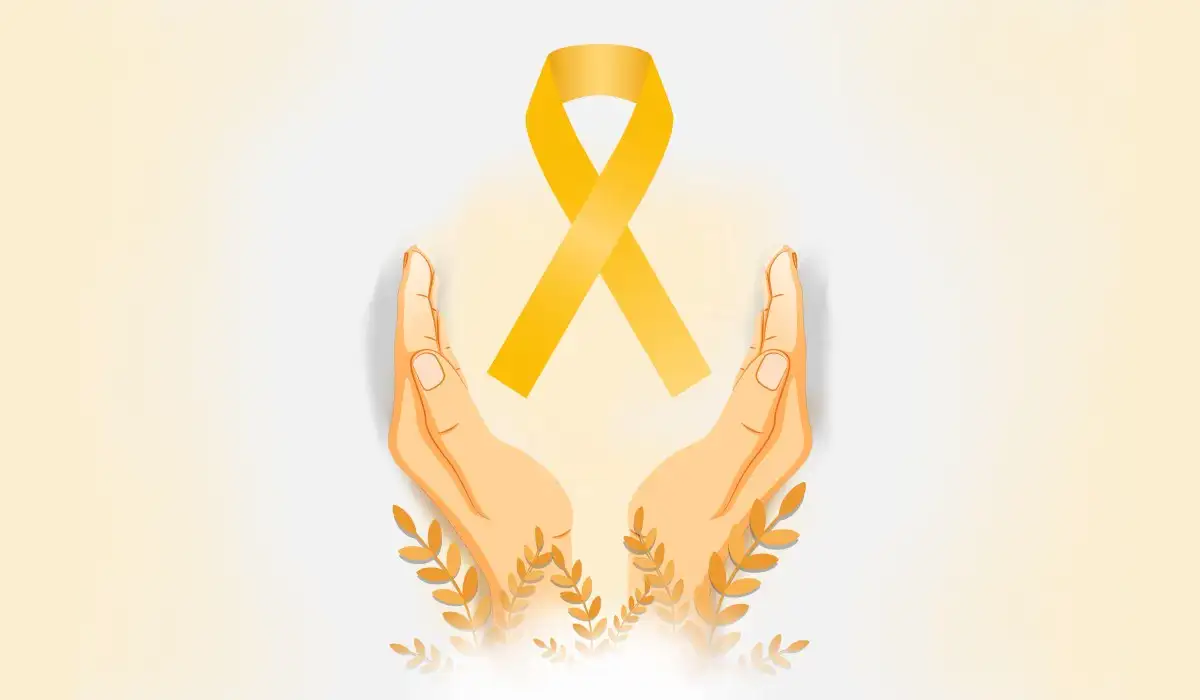 Hands holding a golden ribbon in albinism awareness