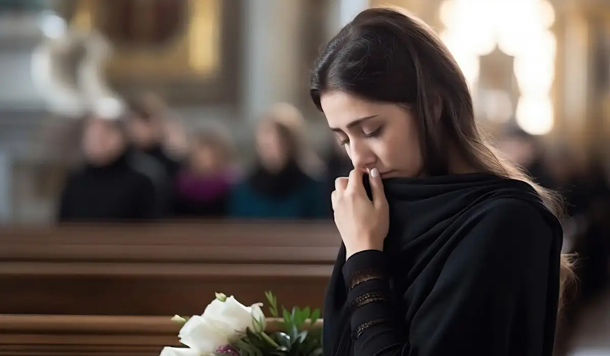 Widowed, grieving and mourning woman in the church