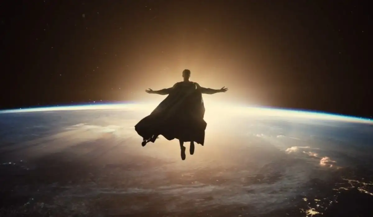 Superman contemplating planet Earth from space with his arms outstretched