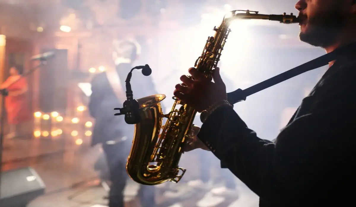 Man plays on a saxophone
