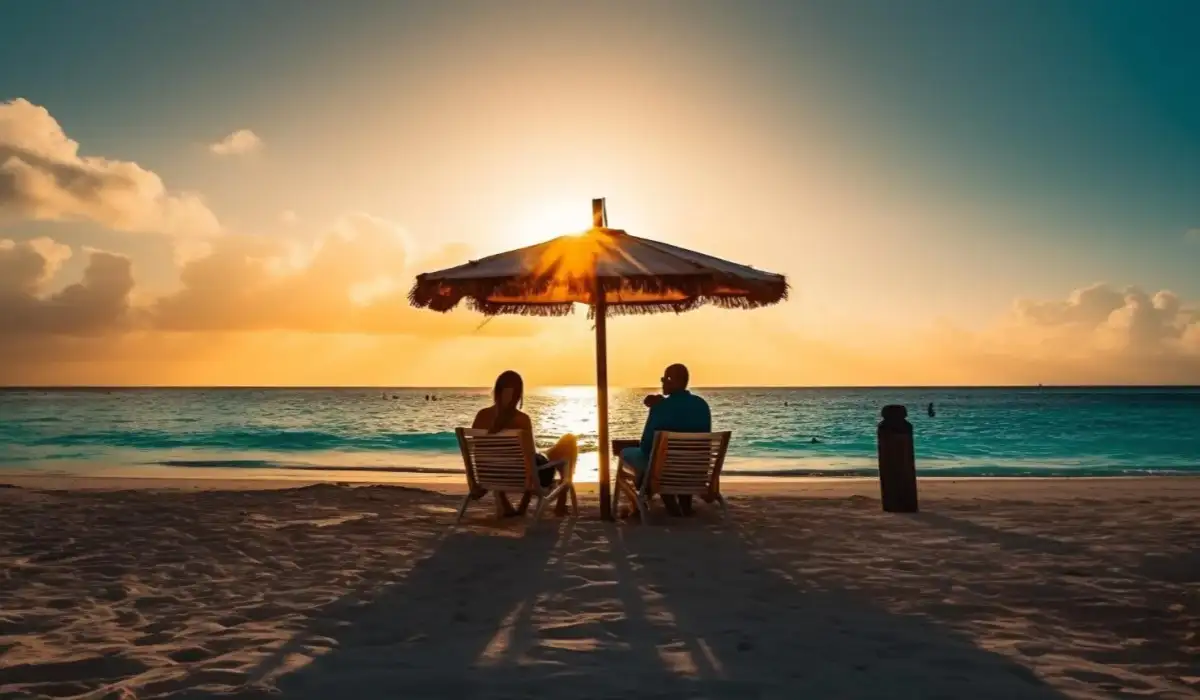 A smiling couple enjoys the sunset on a tropical beach