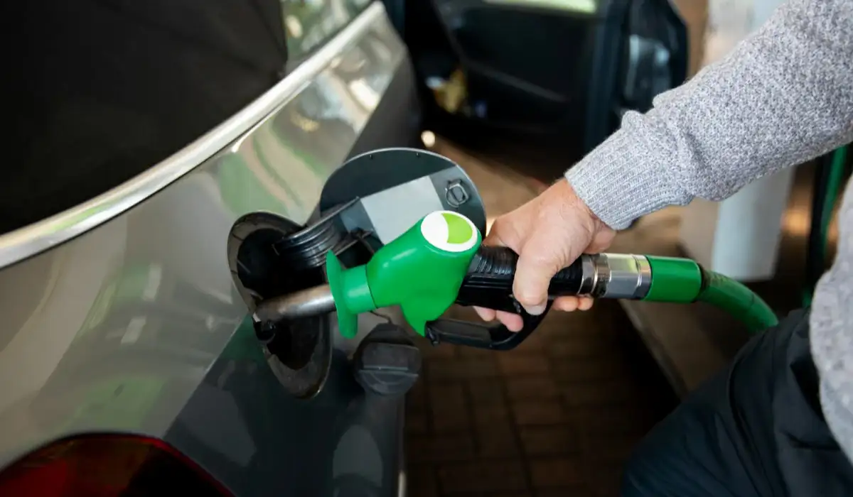 Hand holding biodiesel gas pump