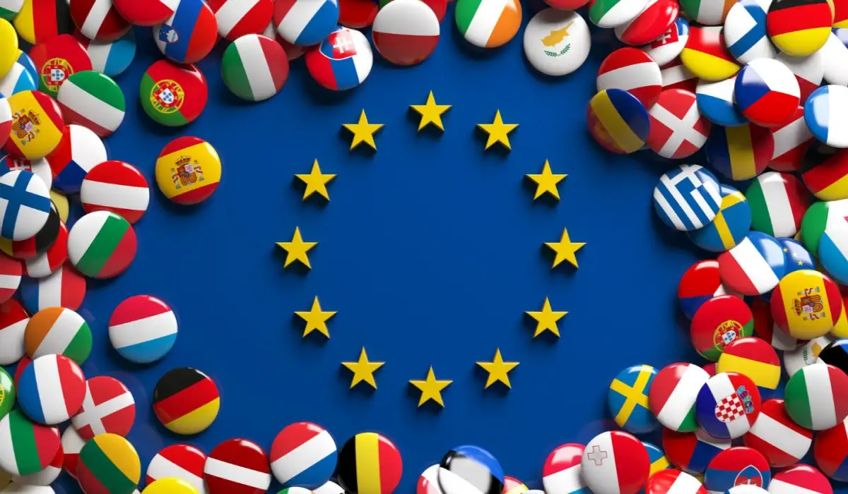 3D rendering of a bunch of shiny European Union flag buttons surrounding the European Union logo
