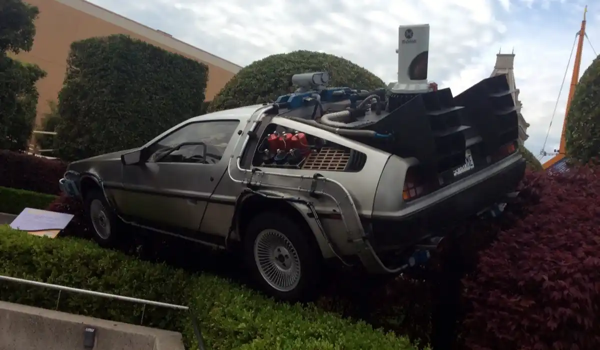 DeLorean time machine from Back to the Future over some bushes