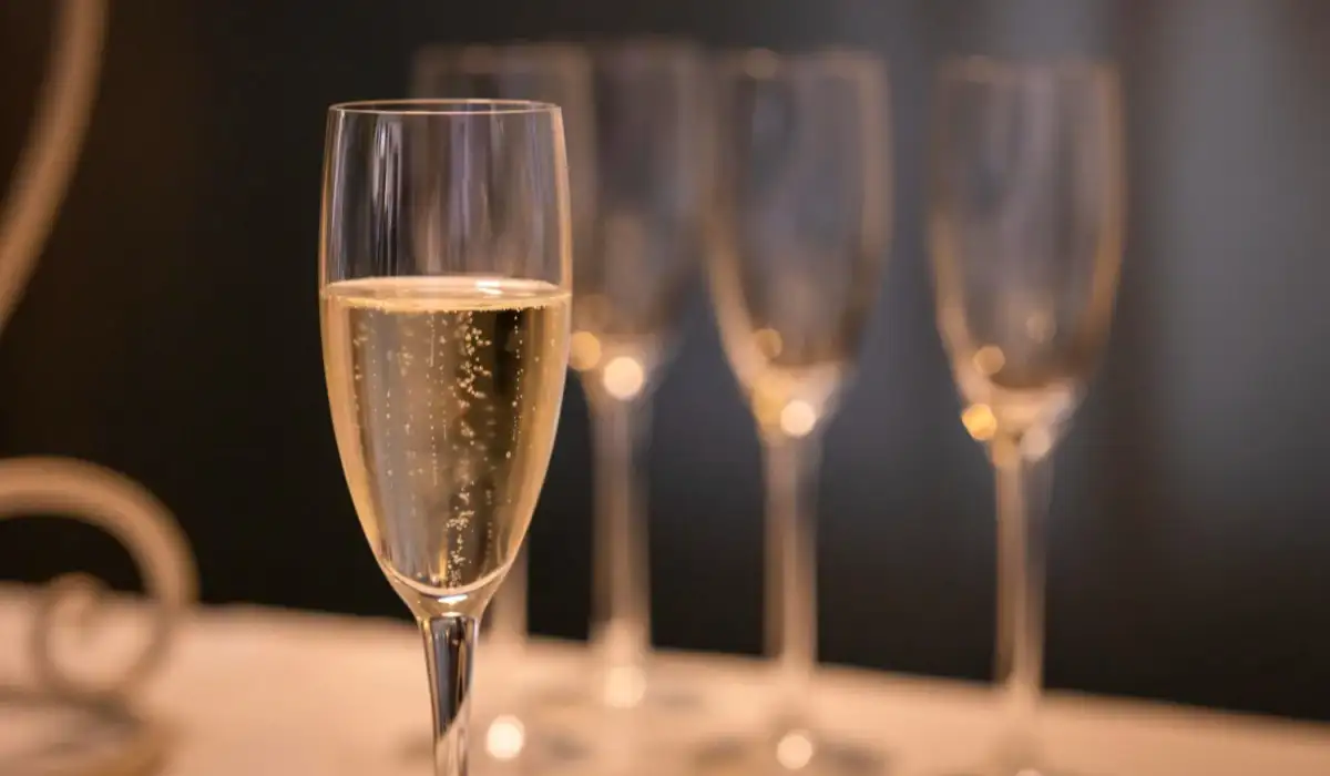 Close-up of glass of champagne and on a blurred background other glasses