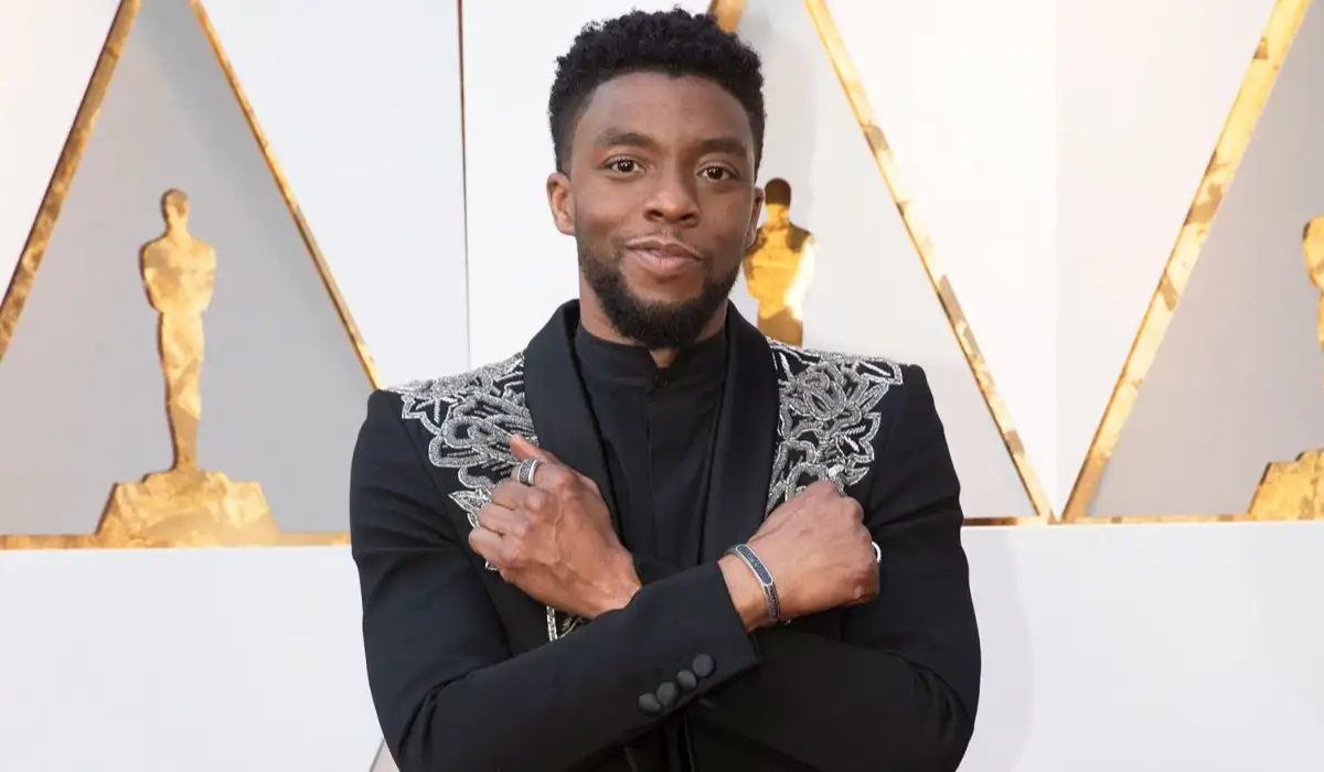 Chadwick Boseman with arms crossed as Black Panther