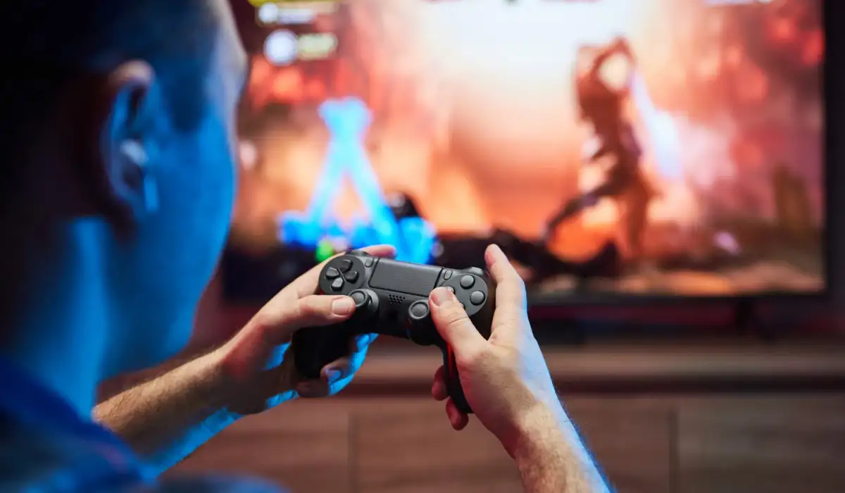 A man enjoying playing a video game on PS4