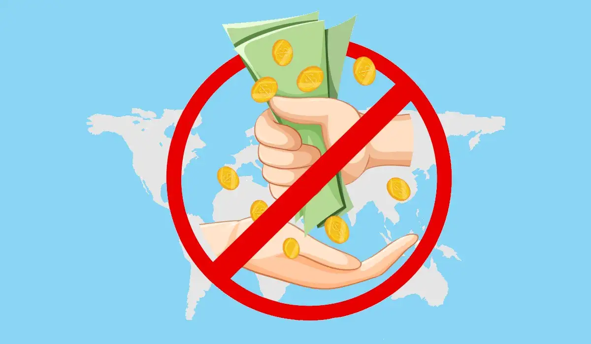 Hands giving money with a prohibited sign in symbolization of anti-corruption