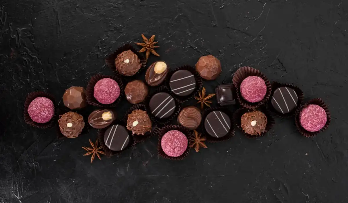 Various chocolate candy sweets on a table top view