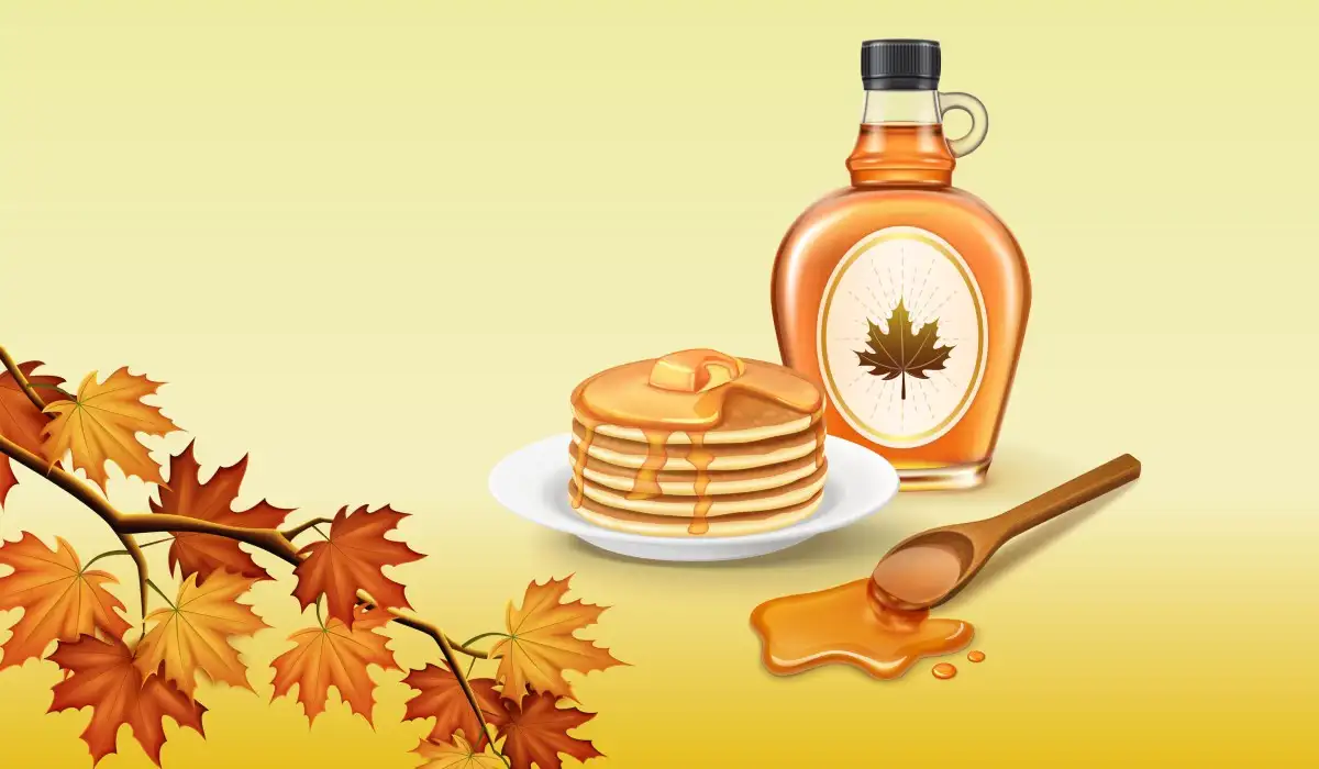 Organic natural product maple syrup with pancakes and autumn leaves on the side